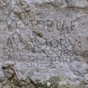 Close-up of an ancient Roman inscription on a stone tablet in Trencin, Slovakia during one day trip to Trencin