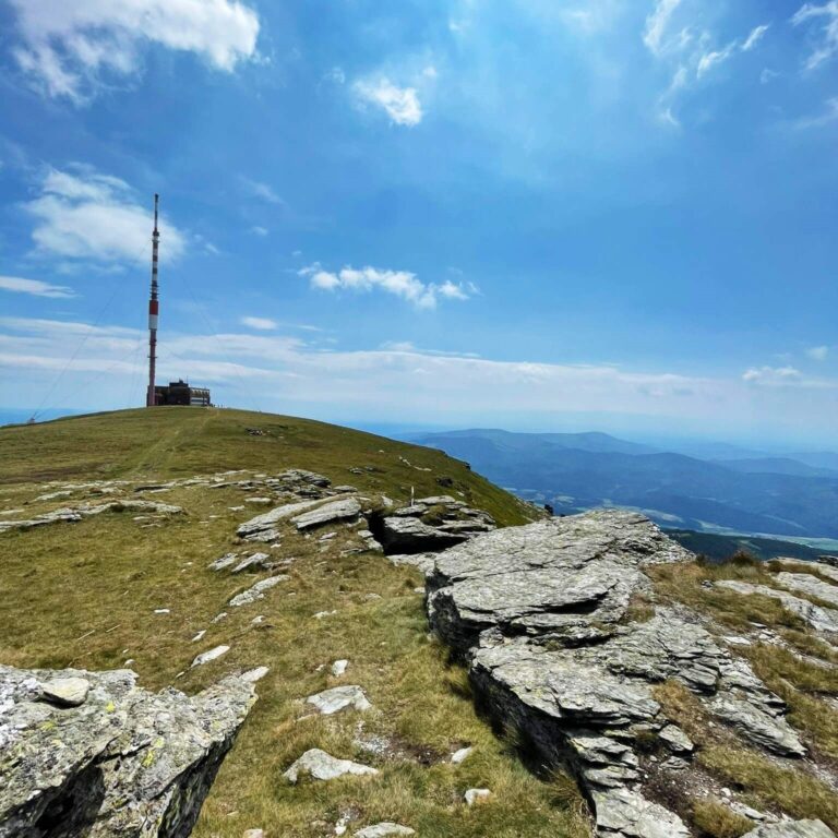 Kralova Hola Peak a picture with TV tower during a day trip from Hight Tatras to Telgart