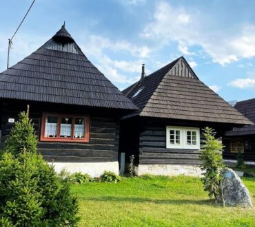 The wooden houses in Orava small village Podbiel. Photo taken in orava region during hot summer day.