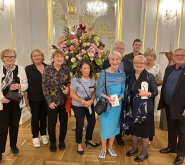 Irish senior clients posing in a building of Slovak Philharmonic Orchestra called also Reduta prior concert during their Bratislava Musical Festival Tour